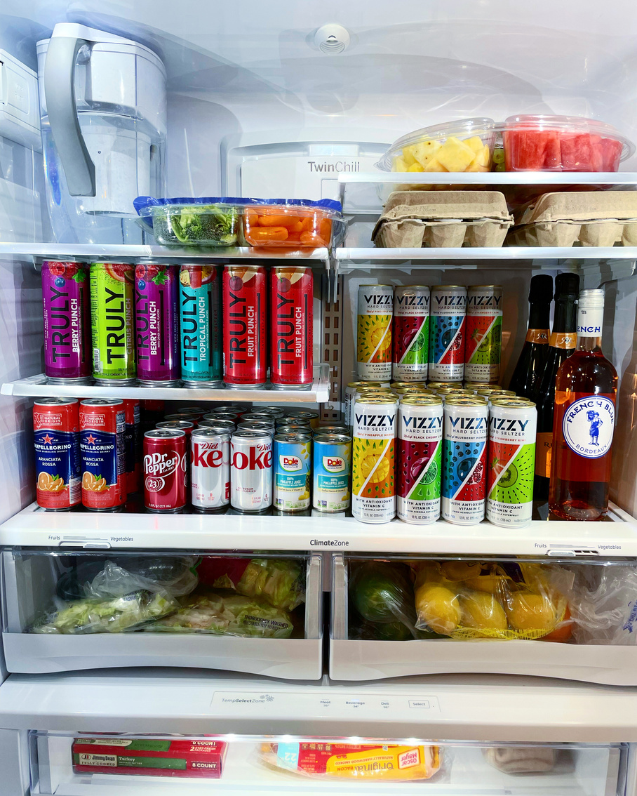a refrigerator filled with drinks and food